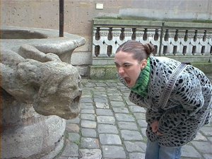 me conversing with a fountain in the Cluny Museum's courtyard