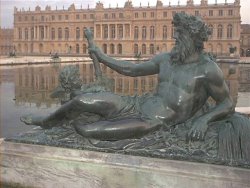 a statue in a Versailles fishpond